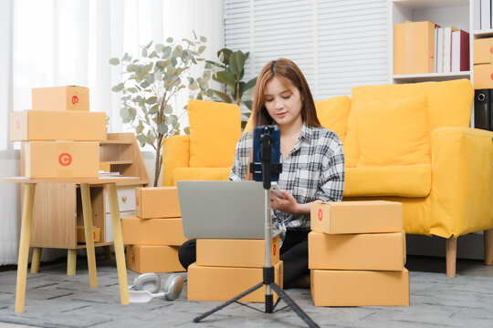 Starting small businesses SME owners female entrepreneurs working on receipt box and check online orders to prepare to pack the boxes, sell to customers, sme business ideas online.