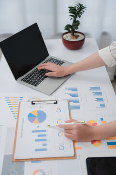 Business financing accounting banking concept. Business woman hand doing finances and calculate on desk about cost at home office. Woman working on desk with using calculator, finance accounting.	