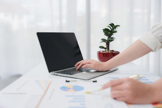 Business financing accounting banking concept. Business woman hand doing finances and calculate on desk about cost at home office. Woman working on desk with using calculator, finance accounting.	