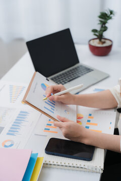 Business financing accounting banking concept. Business woman hand doing finances and calculate on desk about cost at home office. Woman working on desk with using calculator, finance accounting.	