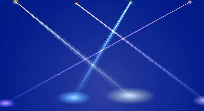 Bright searchlight beams shining in dark night sky over city