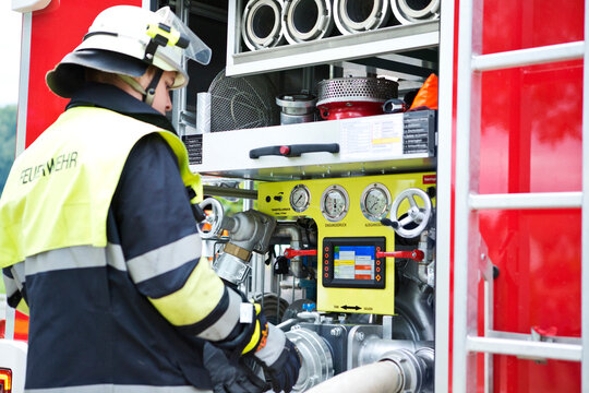 Firefighter at fire engine