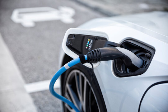 Electric car gettig charged at an charging station