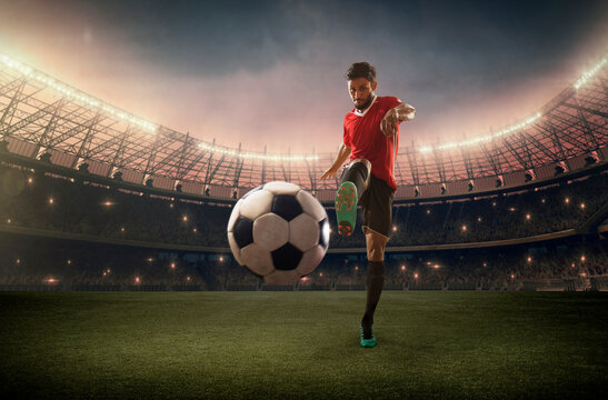 Football Player kicking the ball