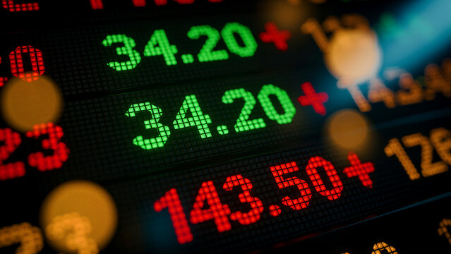 Stock market ticker display showing rising share prices. Glowing green and red digits track real-time financial fluctuations on a digital screen. Investment growth concept for trading news.