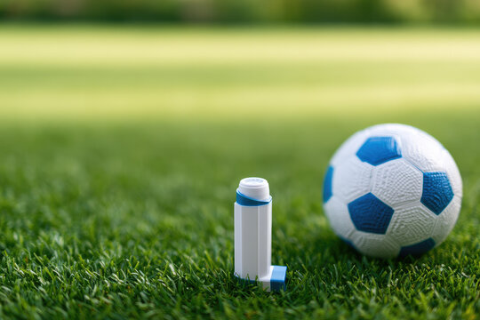 Rescue inhaler soccer field grass close up clean sunlight sports medicine emergency treatment respiratory care asthma relief ball green field