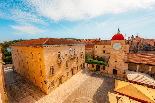 panoramic view over the historic red roofs of Trogir old town and the Adriatic sea from the bell tower of St. Lawrence Cathedral, Croatia.