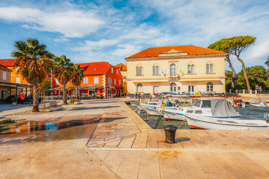 Jelsa town on Hvar island, with traditional Dalmatian stone architecture and boats moored in the harbor, Croatia.