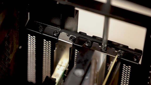 A close-up of multiple graphics cards or expansion cards installed in a desktop computer case with visible cooling fans.