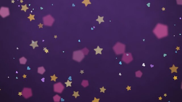Vibrant gold stars and soft hearts slow motion floating, deep purple backdrop