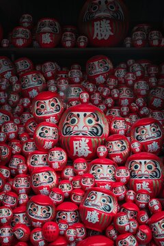 Pile of red daruma dolls at Katsuoji temple Osaka Japan traditional good luck charms