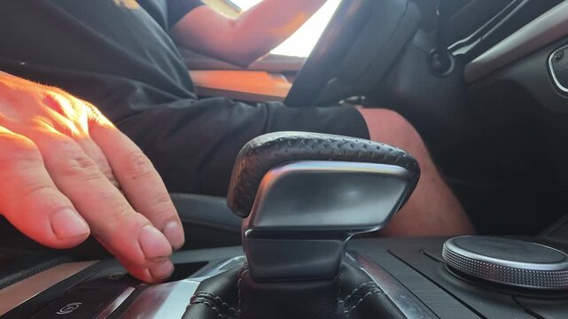 Person hand moving gear shift of car, engaging drive mode for travel, interior view of vehicle cockpit, close up perspective of dashboard controls, journey preparation, dsg