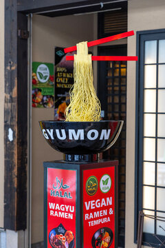 Gyumon ramen restaurant display showing floating ramen noodles Osaka