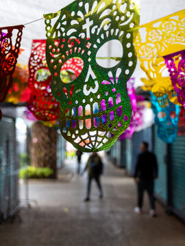 Colorful Sugar Skull Papel Picado Decorations Celebrating Day of the Dead in Mexico