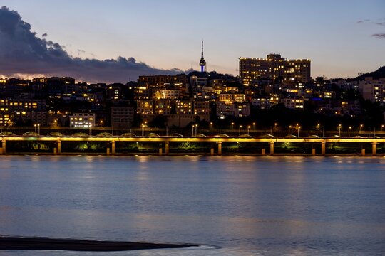 Twilight view of N Seoul Tower and Han River waterfront in Seoul, South Korea