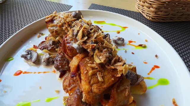 Gourmet dish presentation of succulent roasted chicken with sauteed mushrooms and crispy fried onions, colorful sauce drizzles enhancing visual appeal