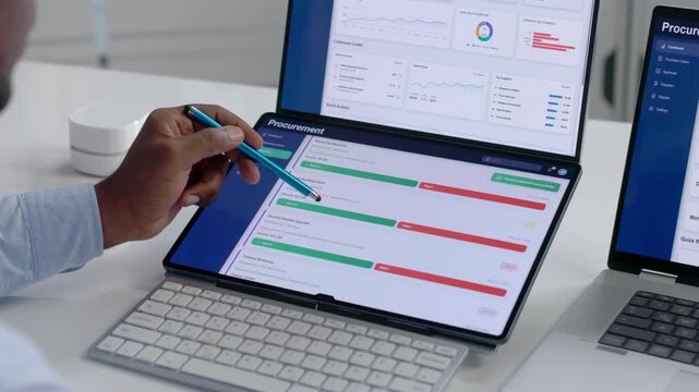 Procurement Manager Works On Laptop