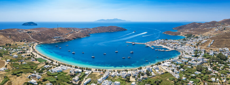 Panoramic aerial view of the bay of Livadi with beach, marina and port, Serifos island, Cyclades, Greece, during summer time