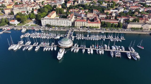 Drone shot of boats and yachts in marina harbour, Pula city, Croatia