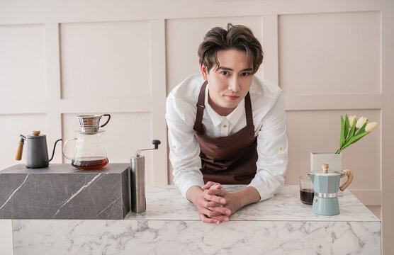 Startup successful small business owner man sme, handsome men sit in coffee shop restaurant. Portrait of young relax asian man barista cafe local owner. SME sell online entrepreneur business banner