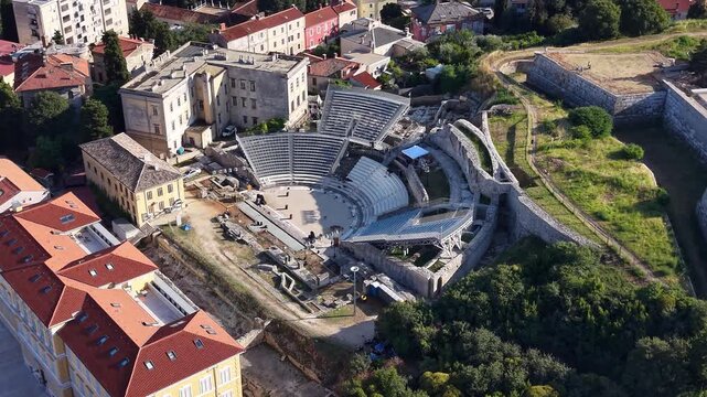 Aerial footage of Small Roman Theatre historical ruins in Pula city, Croatia
