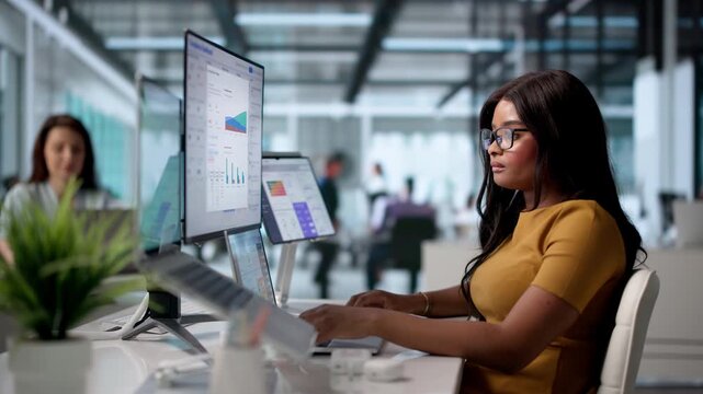 Young Compliance Officer Studies Data Analytics On Laptop