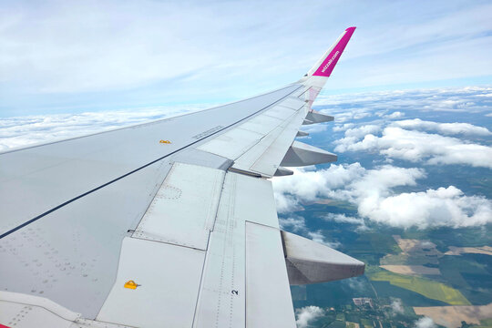 Basel, Switzerland, May 22, 2026: Aerial View from Airplane Wing Over Scenic Cloudscape and Landscape