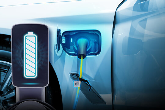 Power cable pump plug in charging power to electric vehicle EV car.