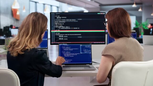 Two Developers Discussing Code Changes
