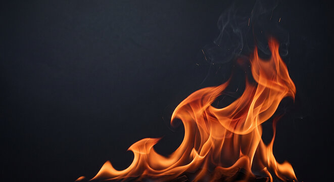 Glowing red and orange fire flames rising on a dark background. Perfect for hot energy concepts.