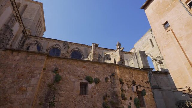 Rear and side view of Cuenca Cathedral stone walls and Gothic windows in Cuenca Spain