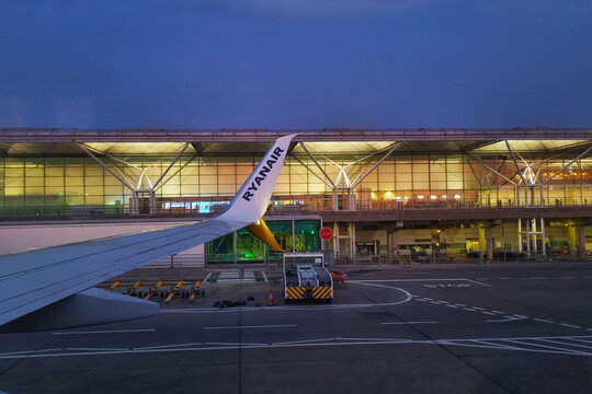 London, United Kingdom, July 13, 2026: Evening View of Airport from Airplane Window with Ryanair Wing for Travel and Aviation Themes