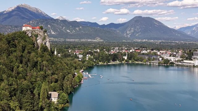 Flight over Bled Castle on cliff by Lake Bled (Bledsko jezero), Slovenia