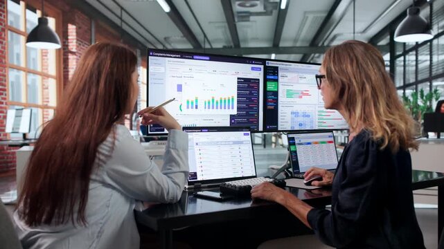 Woman Using Laptop To Review Customer Complaint Trends