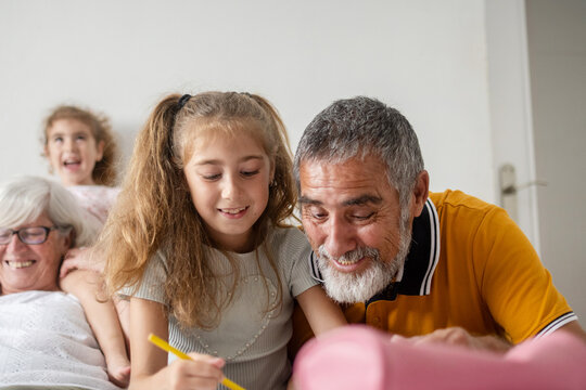 Grandparents spending time with granddaughter