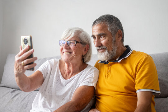 Senior couple taking selfie with smartphone