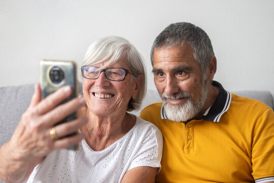 Senior couple taking selfie with smartphone