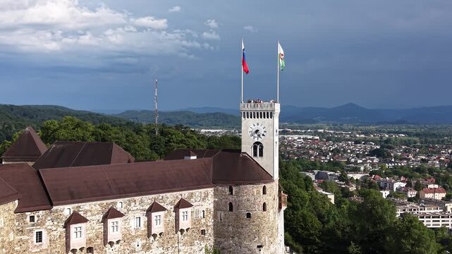 Flight over medieval Ljubljana Castle tower on hilltop in Ljubljana, Slovenia