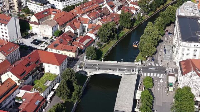 Drone shot of Dragon Bridge (Zmajski most) over Ljubljanica river, Slovenia