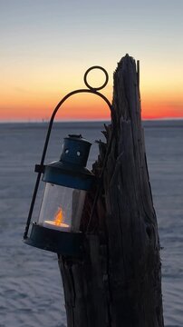 sunset on the beach with lantern 