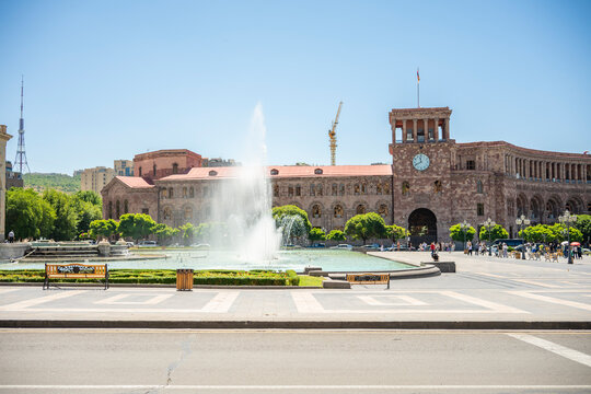 Fountain and Clock Tower at Republic Square under Blue Sky in Yerevan