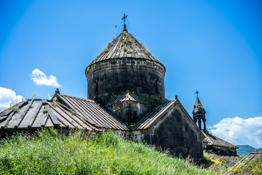 Stone Roofs and Cupolas of Ancient Haghpat Monastery under Blue Sky in Armenia