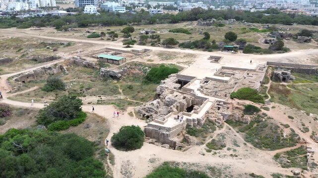 Aerial flyover above ancient underground ruins at Tombs of the Kings in Paphos, Cyprus