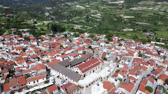 Drone flyover above traditional limestone buildings in Omodos village, Limassol district, Cyprus