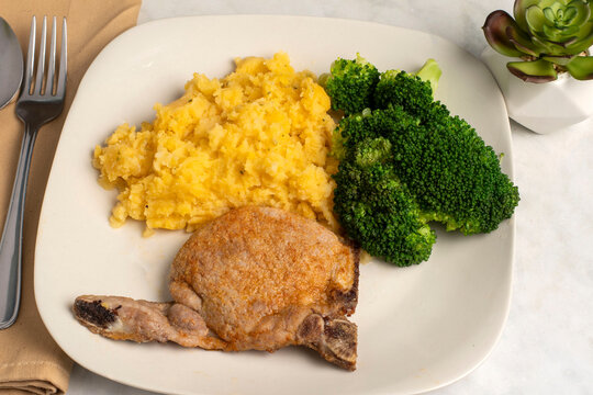 pork chop with  broccoli and chedder mash potatoes