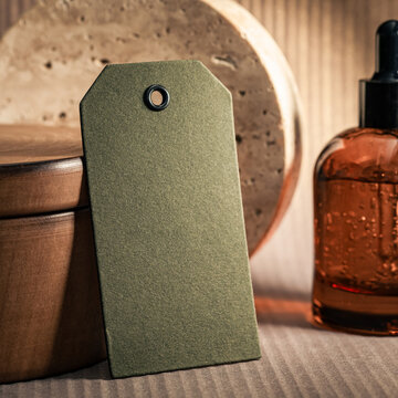 Olive Green Blank Tag Mockup with Amber Glass Bottle and Travertine Background