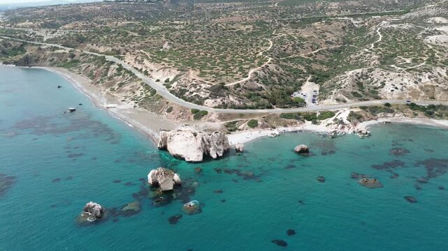 Panoramic drone view of Petra tou Romiou sea stacks and Mediterranean coastline, Cyprus