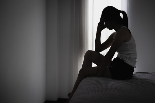 Female victim of abuse and family assault facing fear, trauma, and pain. Concept of human rights, protection, rescue, support, and prevention of harm.