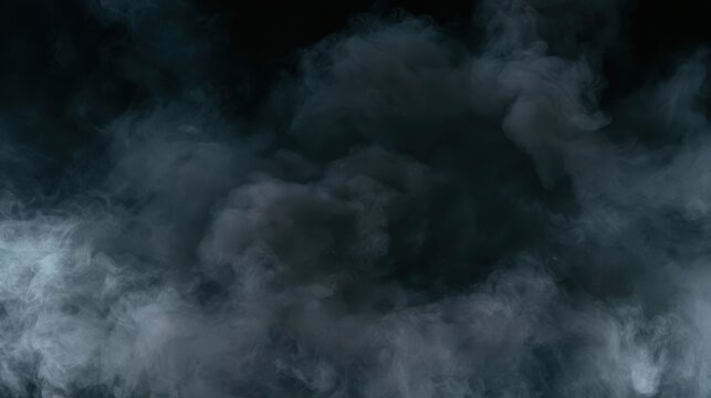 Dense swirling cloud of dark gray and black smoke spreading across a nearly black background, creating a dramatic abstract atmospheric texture.
