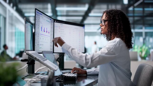 Compliance Officer Reviews Risk Dashboard On Laptop